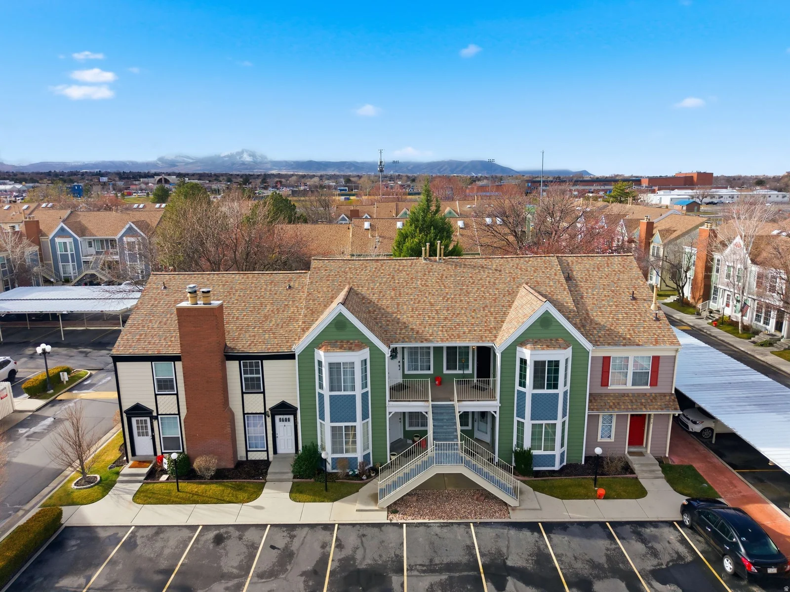 Aerial perspective of suburban area with a mountainous background