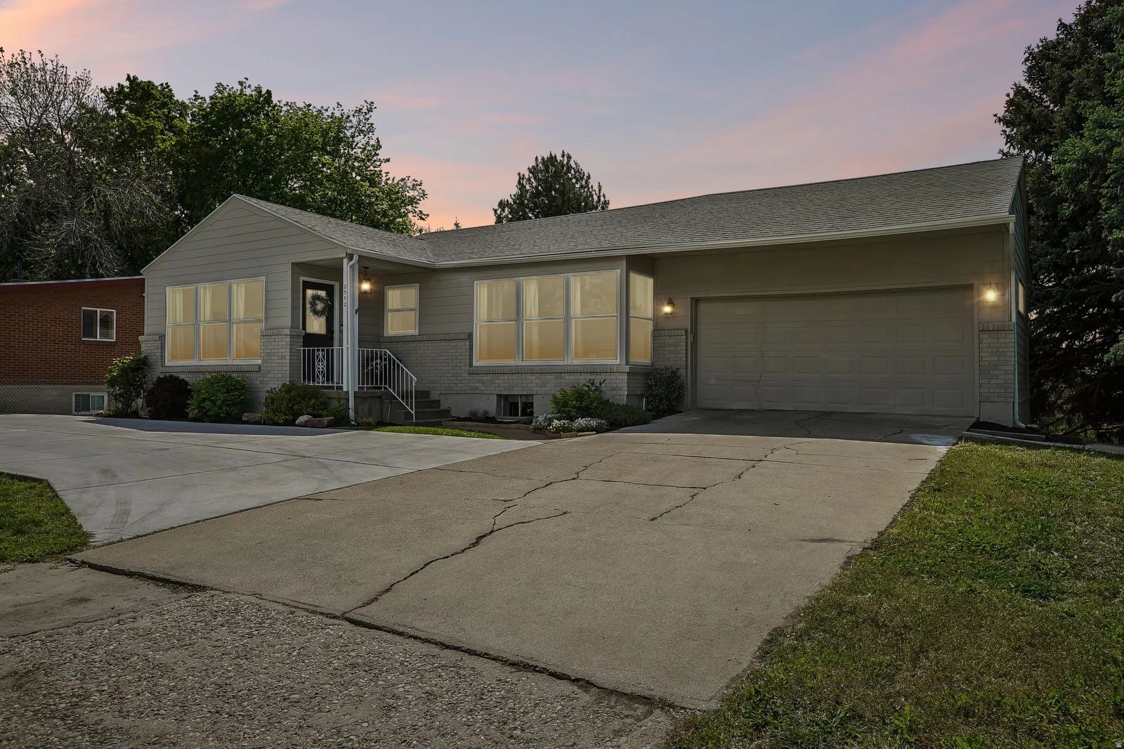 Two-car attached garage with concrete driveway