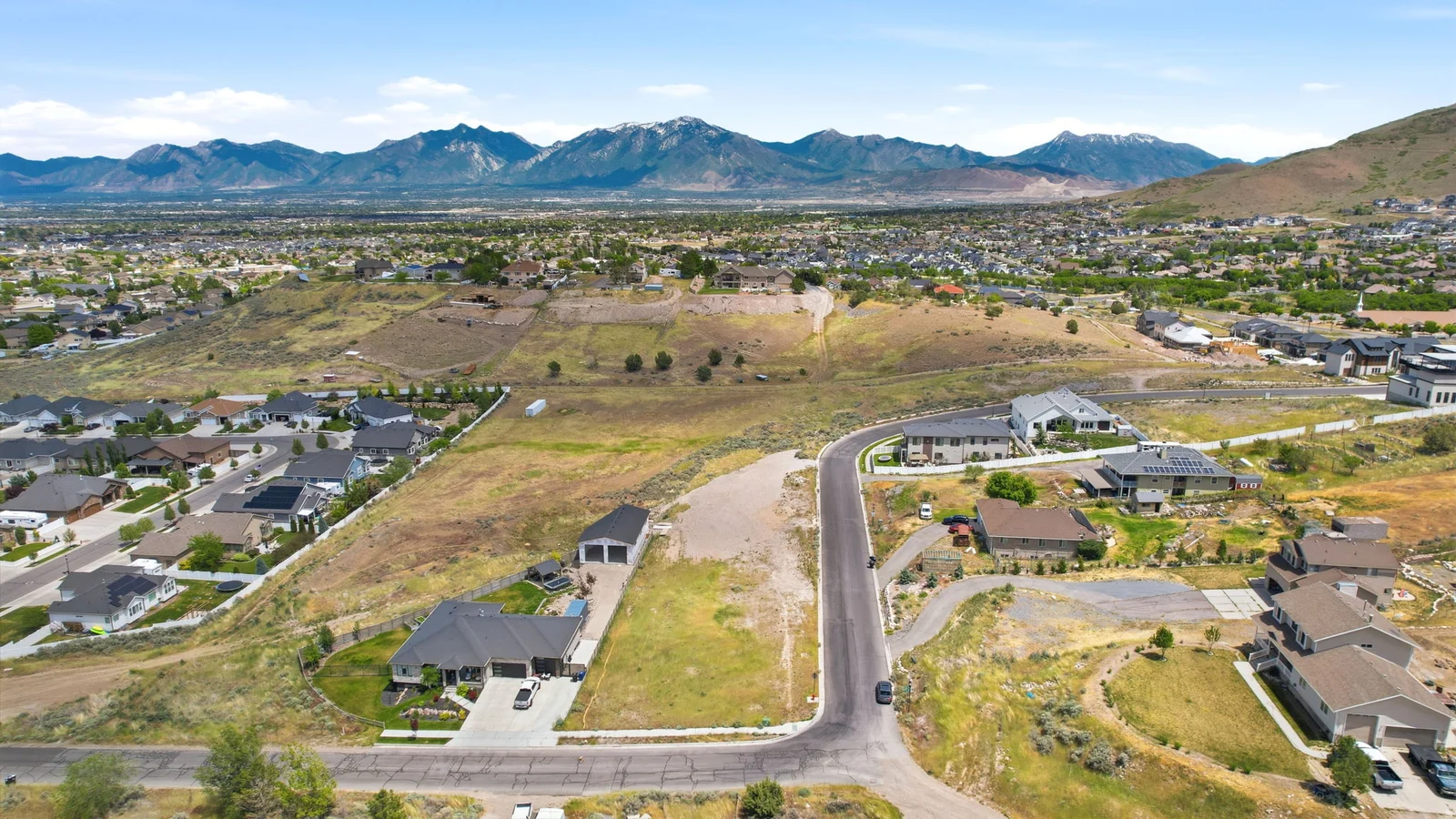 Expansive, undeveloped lot with surrounding residential properties