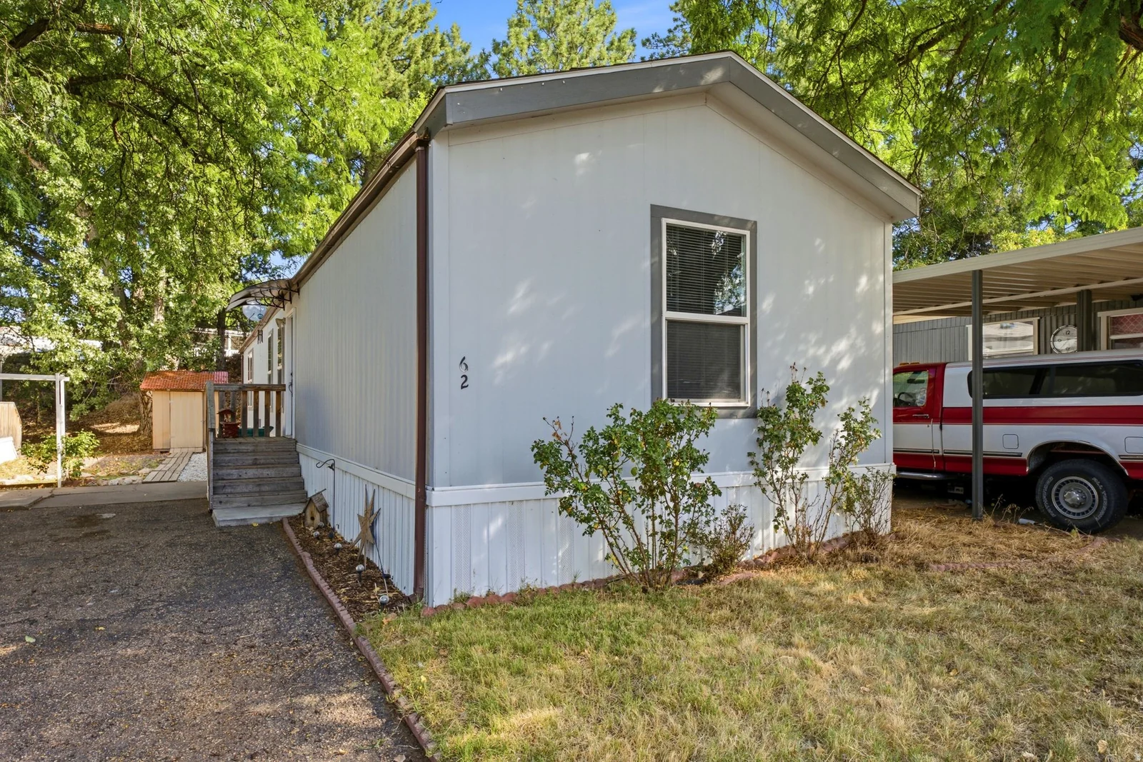 Light-colored exterior siding with white trim