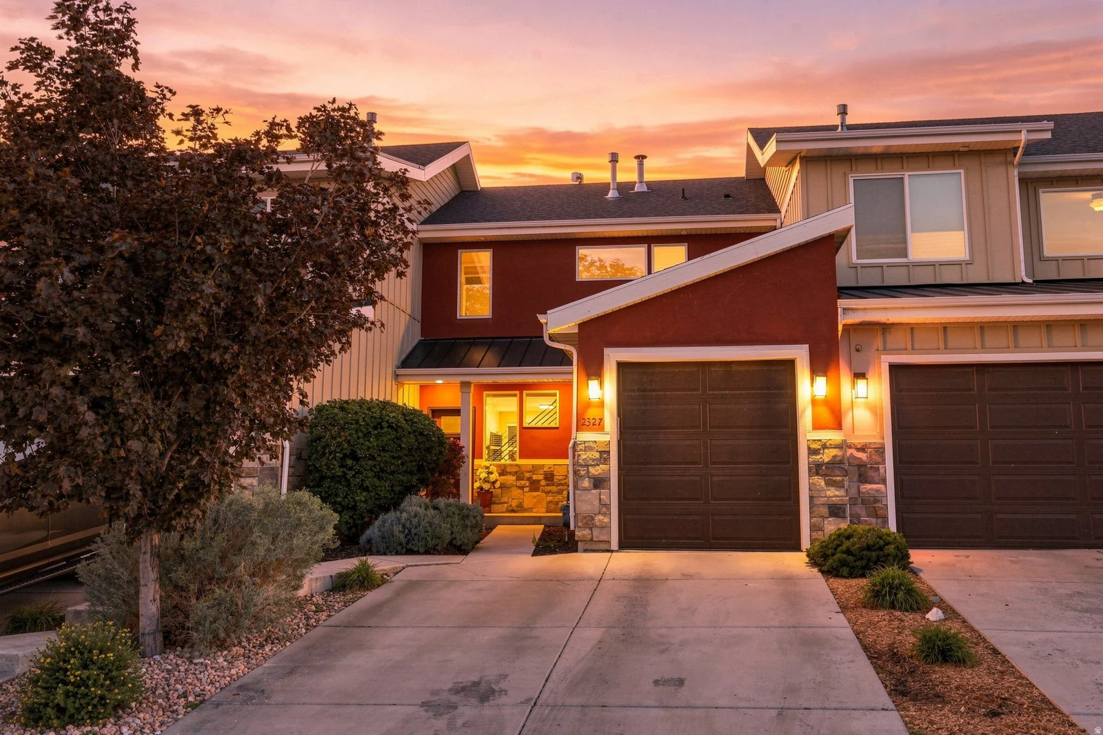 Multi-level exterior with stucco and siding finishes